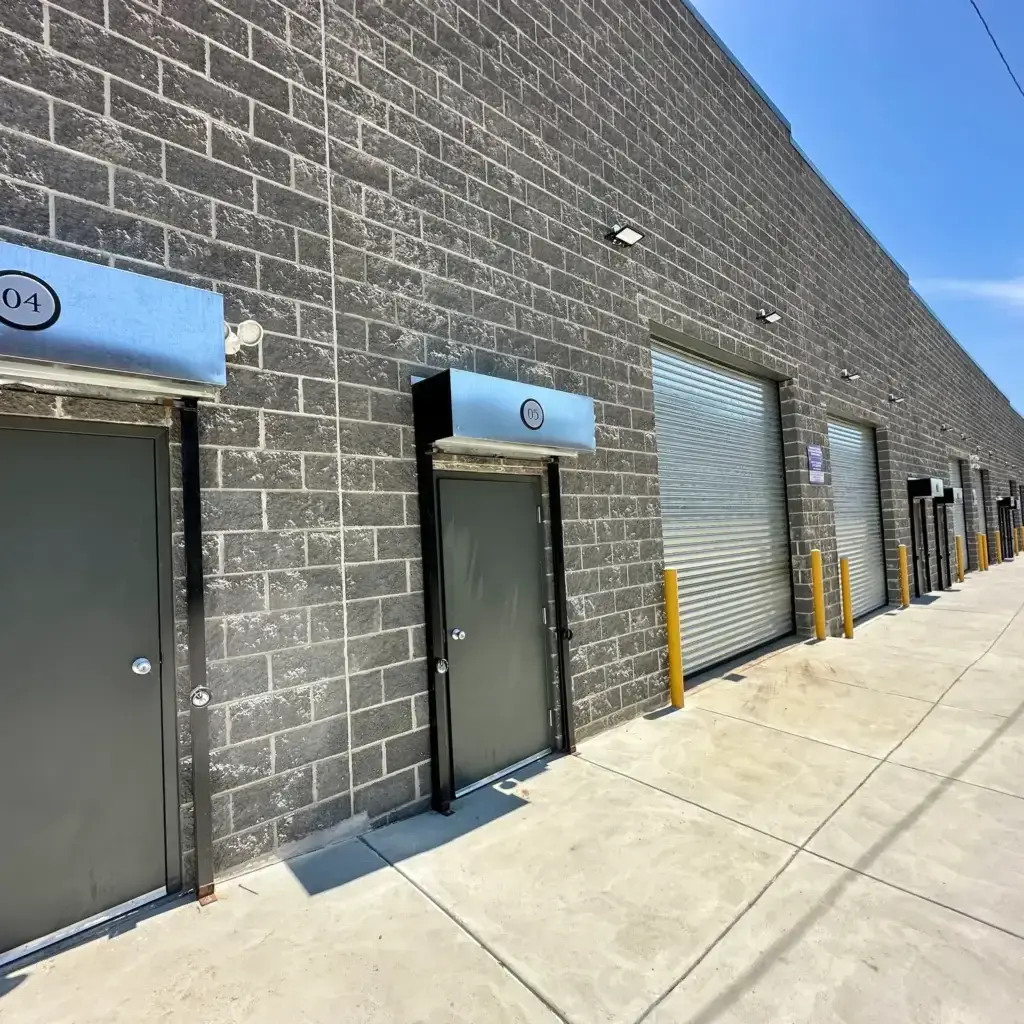 View of the door entrances and garage entrances at the commercial spaces at 3001 Ormes Street