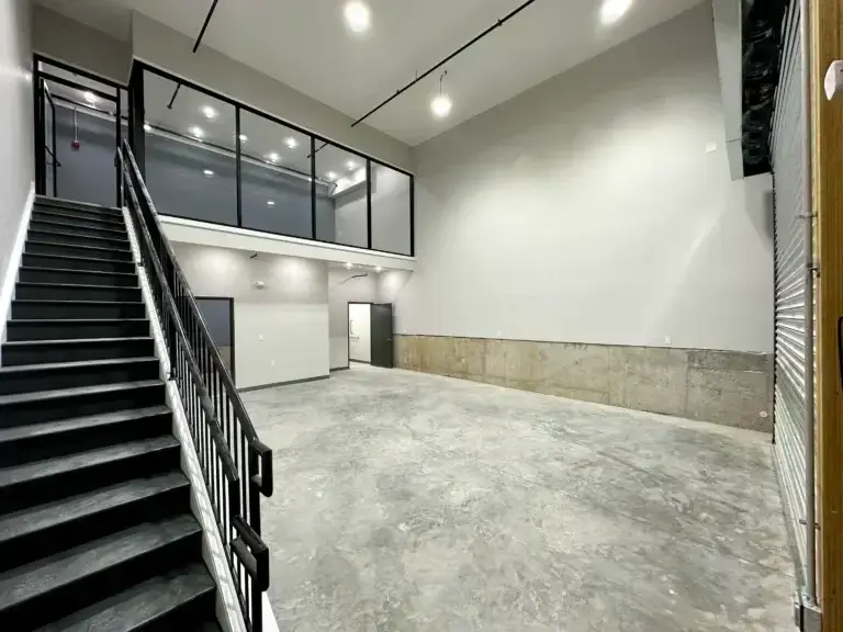 Inside view of the garage entrance at the commercial property at 3001 ormes street with an upstairs office, downstairs open area bathroom and storage closet