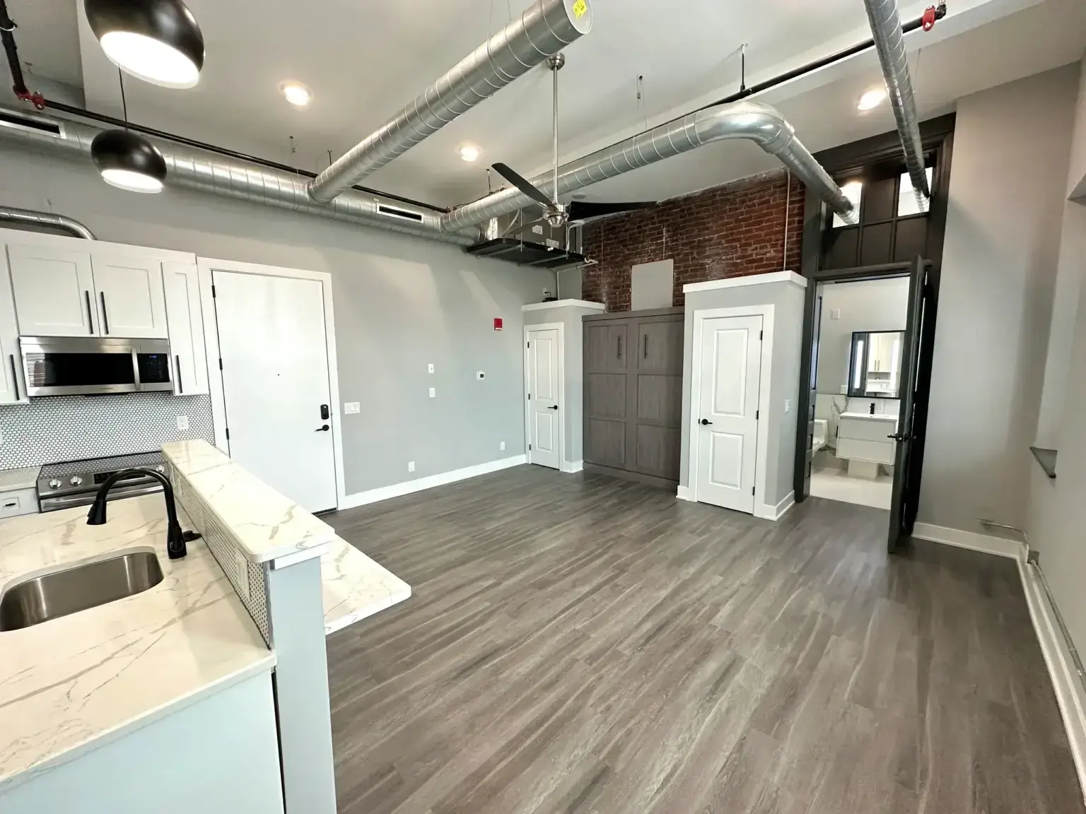 3701 Frankford Ave Unit 202 view into dining area featuring hardwood floors and storage space