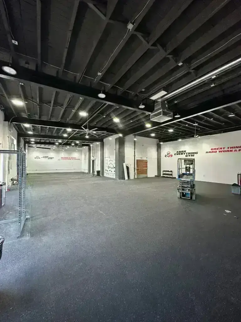 Large open room of Earn Everything Gym almost fully completed